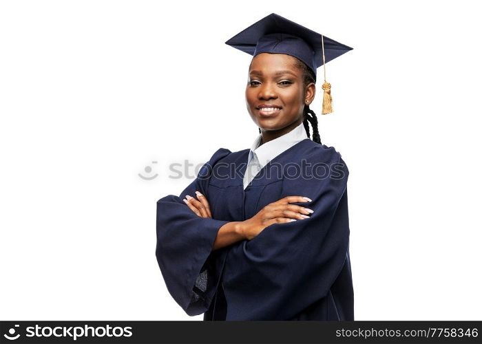education, graduation and people concept - happy graduate student woman in mortarboard and bachelor gown. happy female graduate student in mortarboard