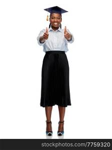 education, graduation and people concept - happy graduate student woman or bachelor in mortarboard showing thumbs up over white background. happy female graduate student showing thumbs up