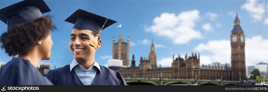 education, graduation and people concept - happy international students in mortar boards and bachelor gowns over big ben clock tower in london city background