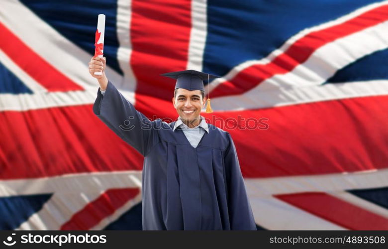 education, graduation and people concept - happy male student in mortarboard and bachelor gown with diploma over british flag background