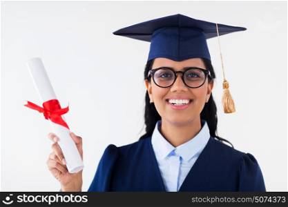education, graduation and people concept - happy student woman in mortarboard and bachelor gown with diploma. happy bachelor woman in mortarboard with diplomas