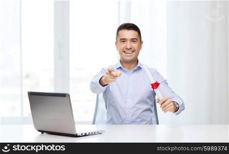 education, graduation, business, technology and people concept - smiling man with diploma and laptop computer pointing finger on you