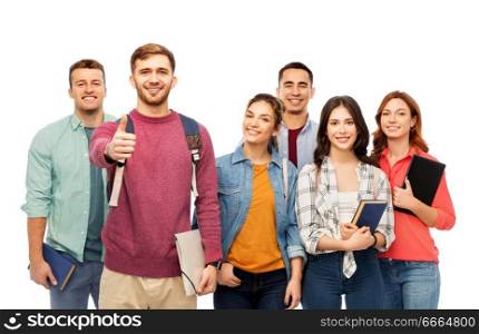 education, high school and people concept - group of smiling students with books showing thumbs up over white background. group of smiling students showing thumbs up