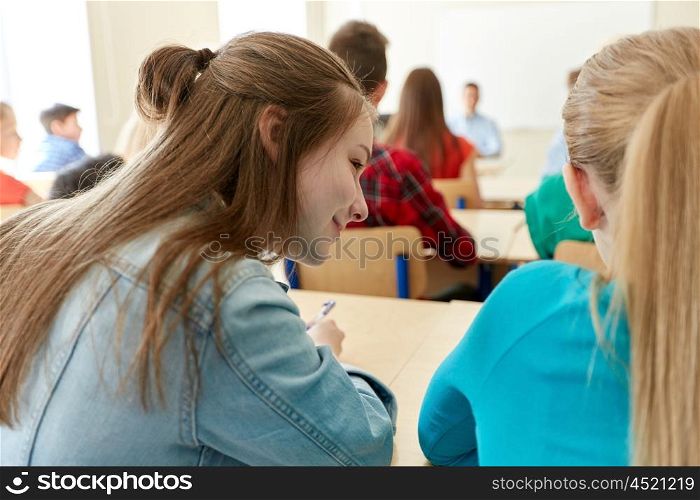 education, high school, learning and people concept - group of students writing test