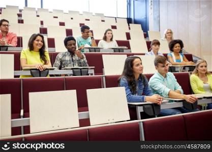 education, high school, university, learning and people concept - group of international students at lecture