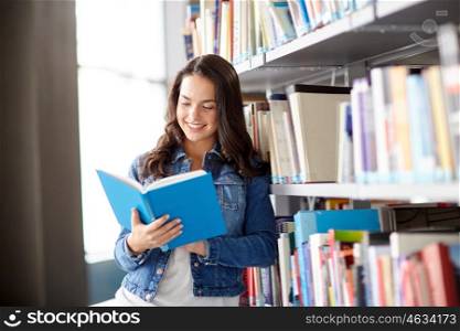 education, high school, university, learning and people concept - smiling student girl reading book at library