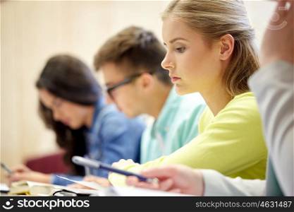 education, high school, university, learning and people concept - student girl at lecture