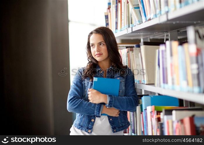 education, high school, university, learning and people concept - student girl with book at library