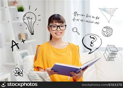 education, knowledge, vision, literature and people concept - smiling young asian woman or student girl in glasses reading book at home over school doodles
