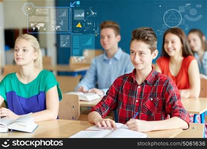 education, learning, statistics and people concept - group of students with books and notebooks at school lesson over virtual screens with charts. group of students with notebooks at school lesson