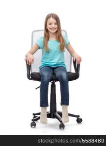 education, office and happy people concept - smiling little girl sitting in big office chair