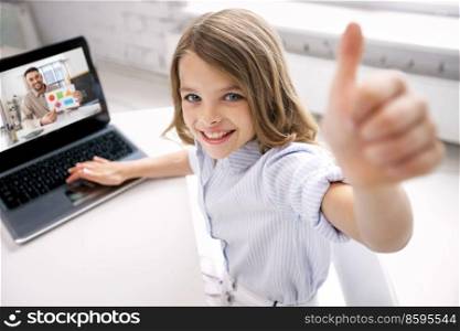 education, online school and technology concept - smiling student girl with laptop computer and teacher on screen showing thumbs up at home. student girl with laptop learning online at home