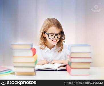 education, people, children and school concept - happy smiling student girl reading book over rose quartz and serenity gradient background. happy smiling student girl reading book