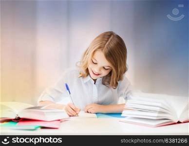 education, people, children and school concept - little student girl sitting at table with books and writing in notebook over rose quartz and serenity gradient background. student girl with books writing in notebook