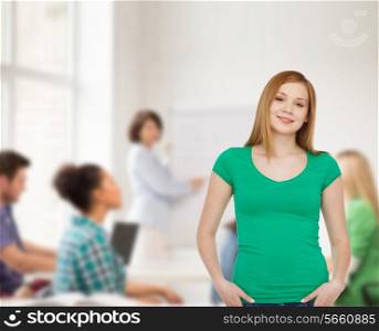 education, school, advertisement and people concept - smiling teenage girl in casual clothes over class background