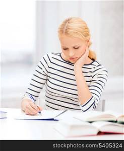 education, school and business concept - concentrated woman with books and notebook studying in college