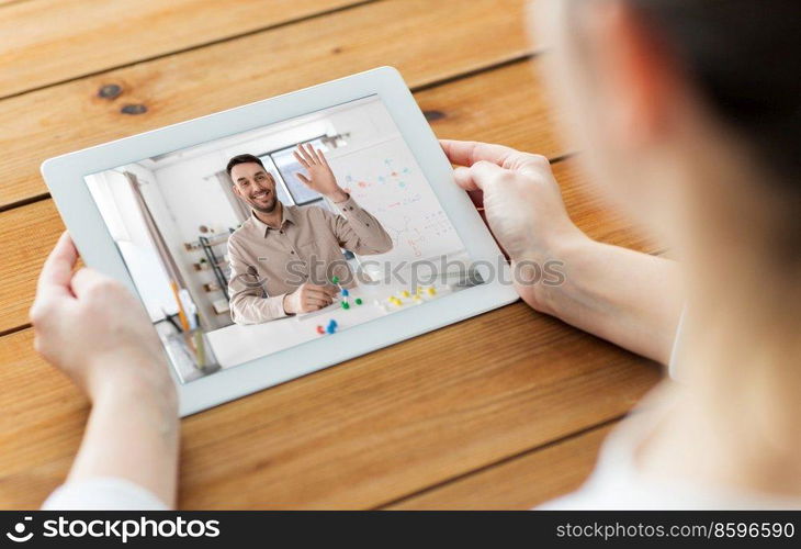 education, school and distance learning concept - close up of woman with chemistry teacher on tablet pc computer screen having online chemistry class. close up of woman with teacher on tablet pc screen