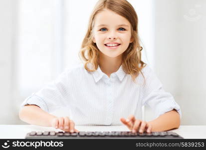 education, school and future technology concept - little student girl with keyboard and imaginary screen at school