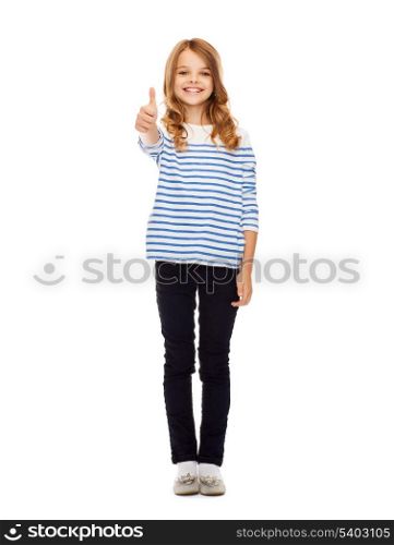 education, school and gesture concept - cute little girl showing thumbs up