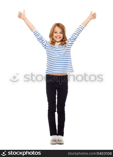 education, school and gesture concept - cute little girl showing thumbs up