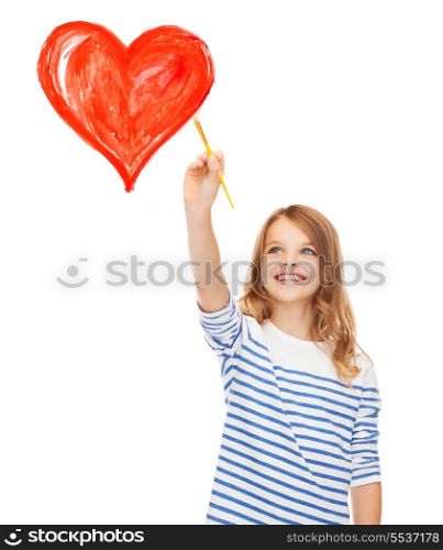 education, school and imaginary screen concept - cute little girl drawing heart with brush