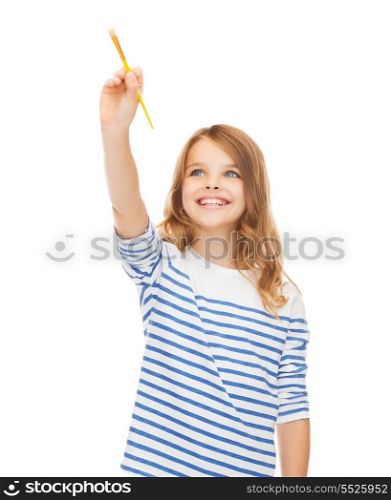 education, school and imaginary screen concept - cute little girl drawing with brush in the air or imaginary screen