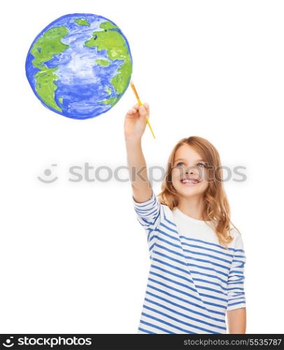education, school and imaginary screen concept - cute little girl drawing with brush planet earth
