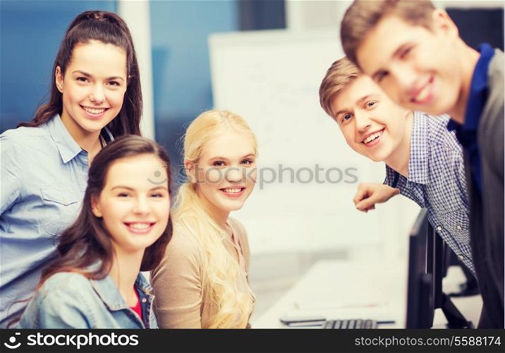 education, school and people concept - group of smiling students having discussion at school