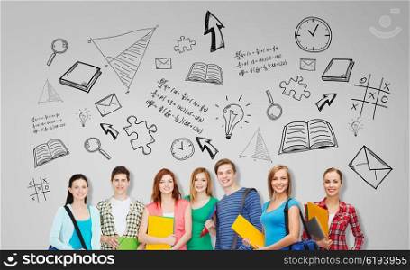 education, school and people concept - group of smiling teenage students with folders and school bags over gray background with doodles