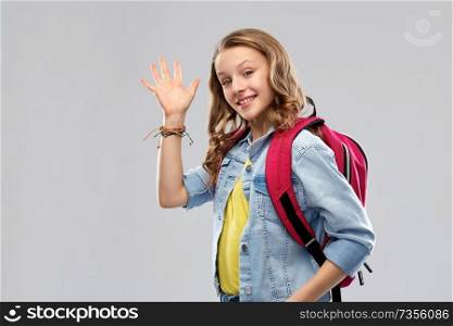 education, school and people concept - happy smiling teenage student girl with bag over grey background. happy smiling teenage student girl with school bag