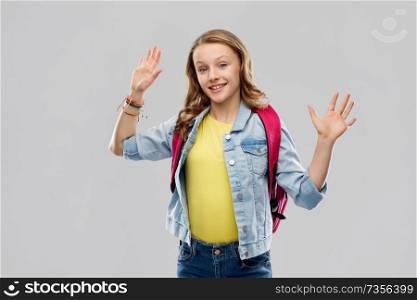 education, school and people concept - happy smiling teenage student girl with bag over grey background. happy smiling teenage student girl with school bag