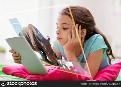 education, school and technology concept - girl with tablet pc computer and hologram projection learning nature online at home. girl with tablet pc learning nature online at home