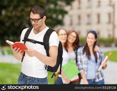 education, school and vacation concept - travelling student in eyeglasses with backpack and book