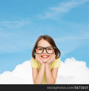 education, school and vision concept - smiling cute little girl in black eyeglasses