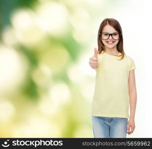 education, school and vision concept - smiling cute little girl in black eyeglasses showing thumbs up