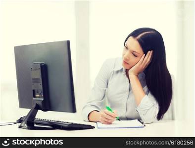 education, school, business and technology concept - tired businesswoman or student studying