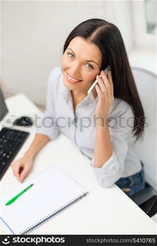 education, school, business, communication and technology concept - smiling businesswoman or student with smartphone and computer