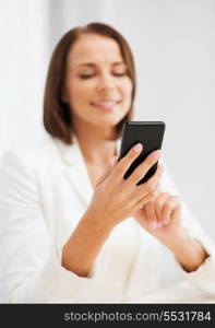 education, school, business, communication and technology concept - smiling businesswoman or student with smartphone texting