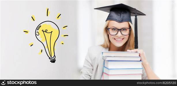education, school, graduation and people concept - happy student girl or woman in graduation cap with stack of books over light bulb doodle