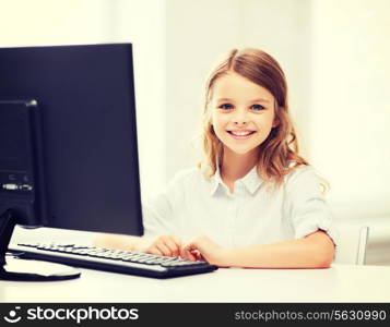 education, school, technology and internet concept - little student girl with computer at school