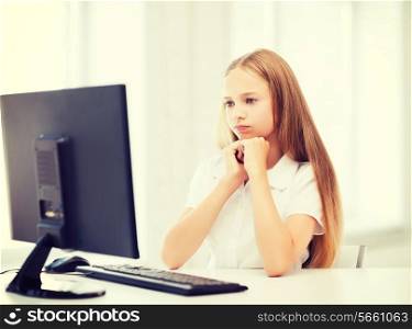education, school, technology and internet concept - little student girl with computer at school