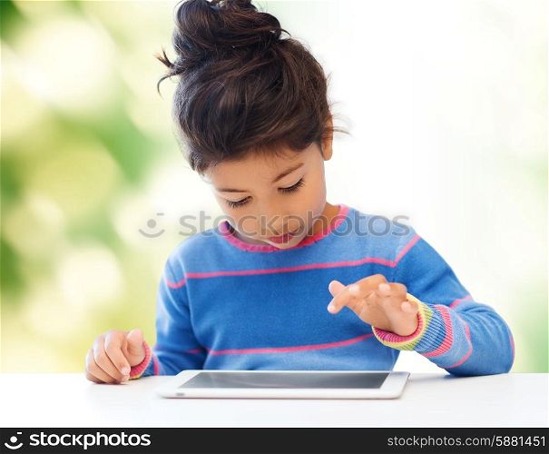 education, school, technology and internet concept - little student girl with tablet pc at home over green background