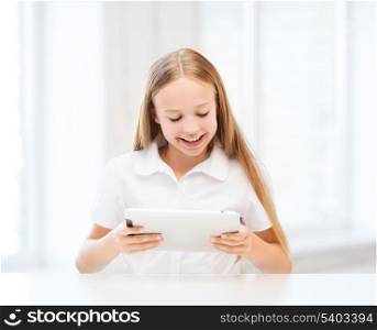 education, school, technology and internet concept - student girl with tablet pc at school