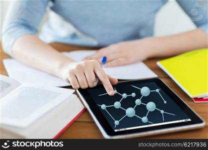 education, science, technology and people concept - close up of student woman with molecule formula tablet pc computer and notebook at home