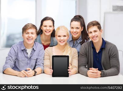 education, technology, advertisement and internet concept - group of smiling students with blank black tablet pc screen