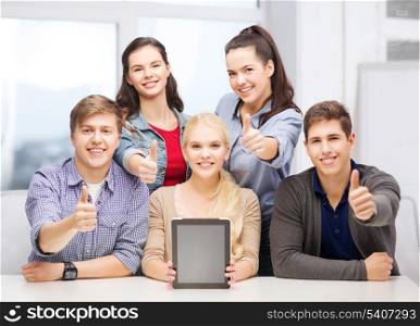 education, technology, advertisement and internet concept - group of smiling students with blank black tablet pc screen showing thumbs up