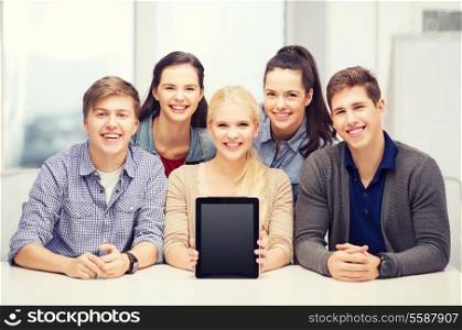 education, technology, advertisement and internet concept - group of smiling students with blank black tablet pc screen