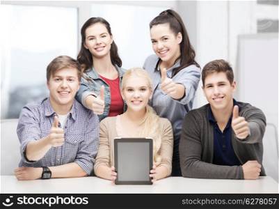education, technology, advertisement and internet concept - group of smiling students with blank black tablet pc screen showing thumbs up