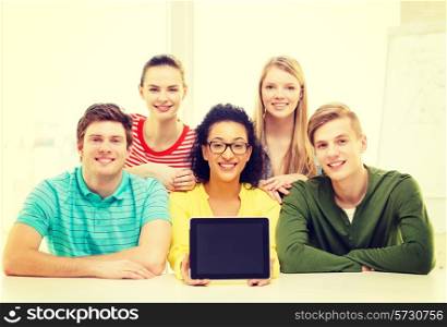 education, technology and college concept - five smiling students showing tablet pc computer blank screen at school