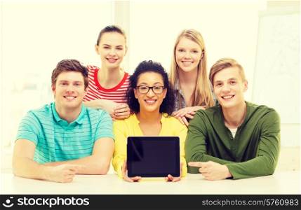 education, technology and college concept - five smiling students showing tablet pc computer blank screen at school